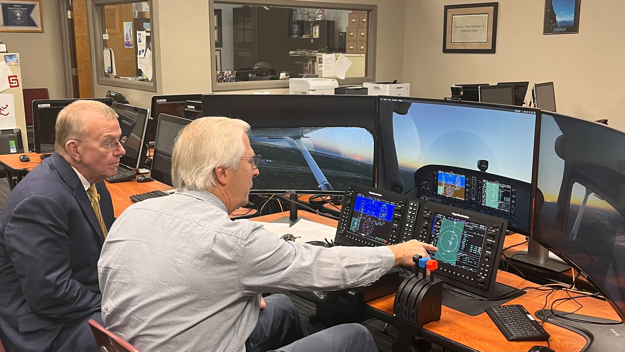 Rep. Ezell is shown the school's flight simulator