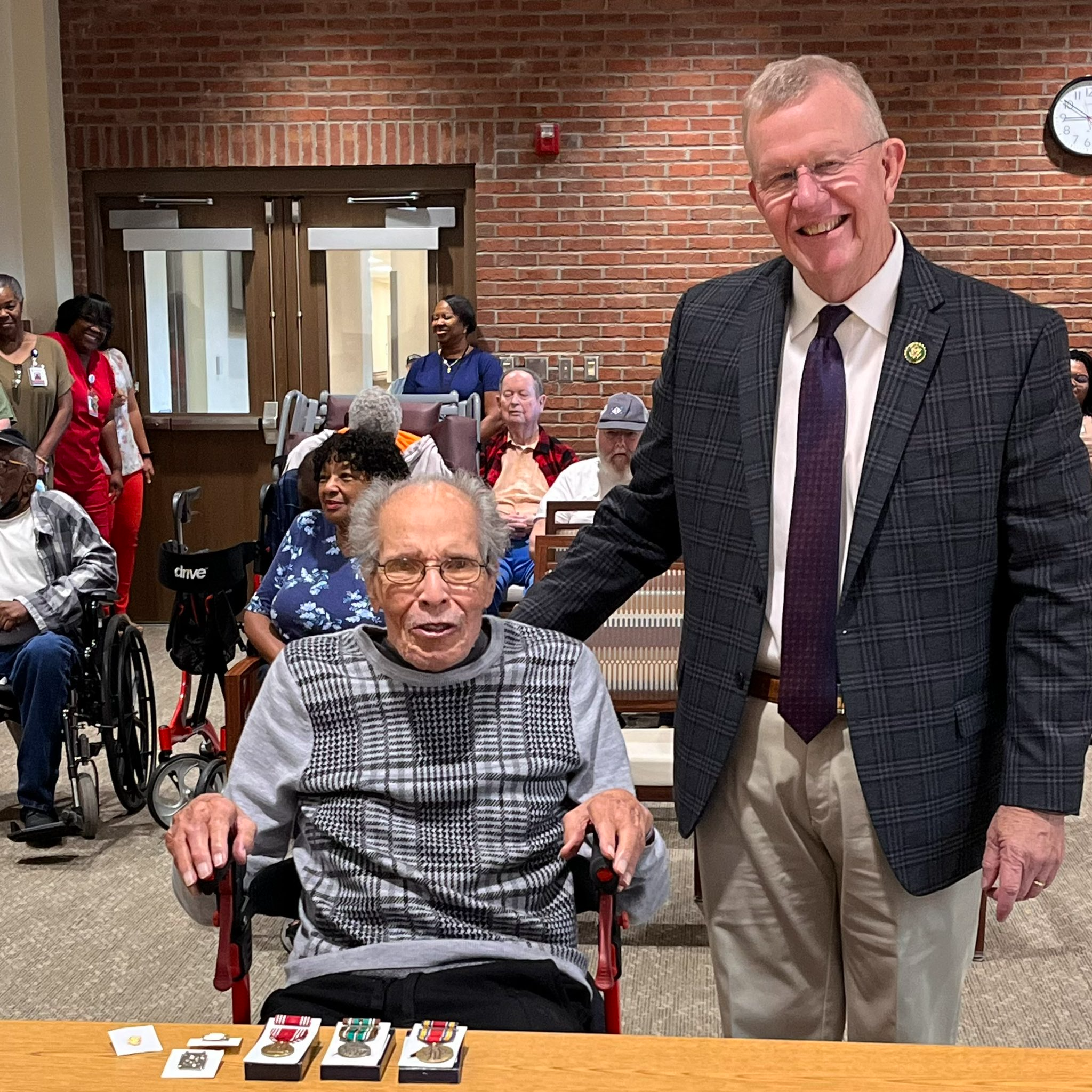 Congressman Ezell presents Sergeant Turner with medals from his service in WWII